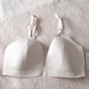 BEIGE ( pinkish beige)  LIGHTLY LINED PLUNGE BRALETTE SIZE MEDIUM NWT